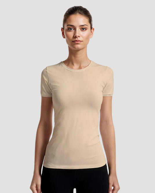 A woman wearing a beige slim-fit T-shirt with short sleeves and a round neckline.