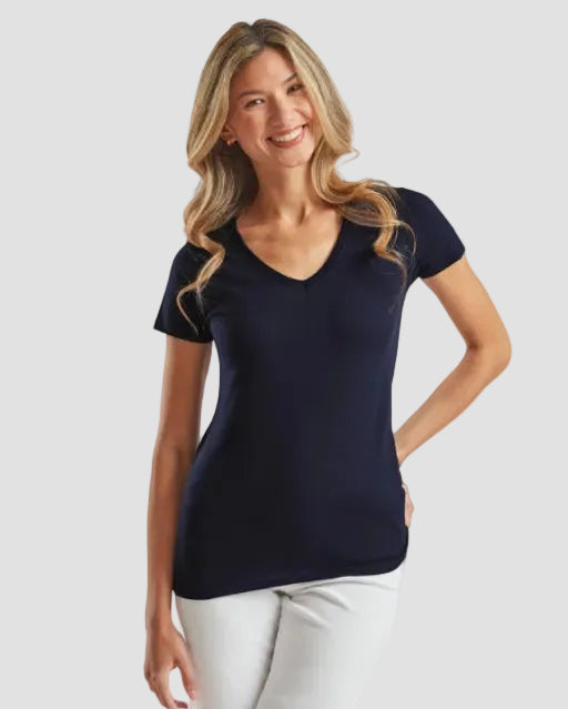 Woman wearing a navy blue t-shirt against a light gray background