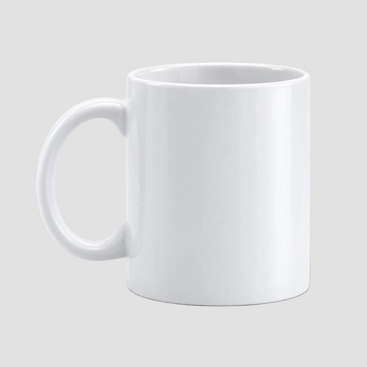 A plain white ceramic mug with a C-shaped handle, shown from a three-quarter angle on a neutral light gray background.