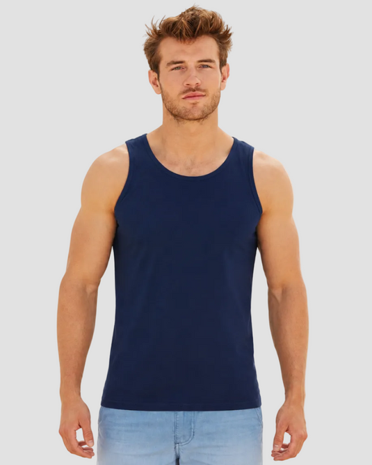 Man wearing a navy tank top on a white background
