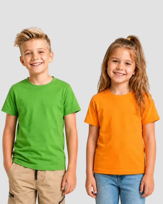 Two children, a boy and a girl, wearing green and orange t-shirts respectively on a white background.