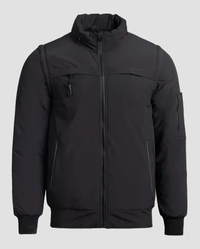 Black jacket with zippers and pockets on a light gray background