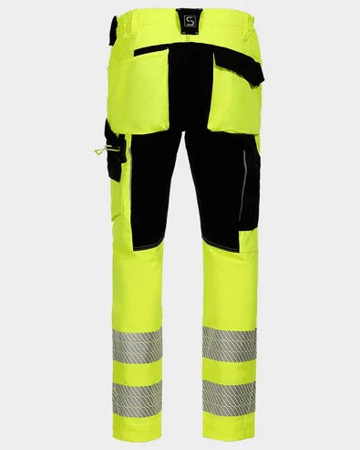 High-visibility neon yellow work pants with black reinforced panels and reflective silver stripes near the lower legs, shown on a light gray background.